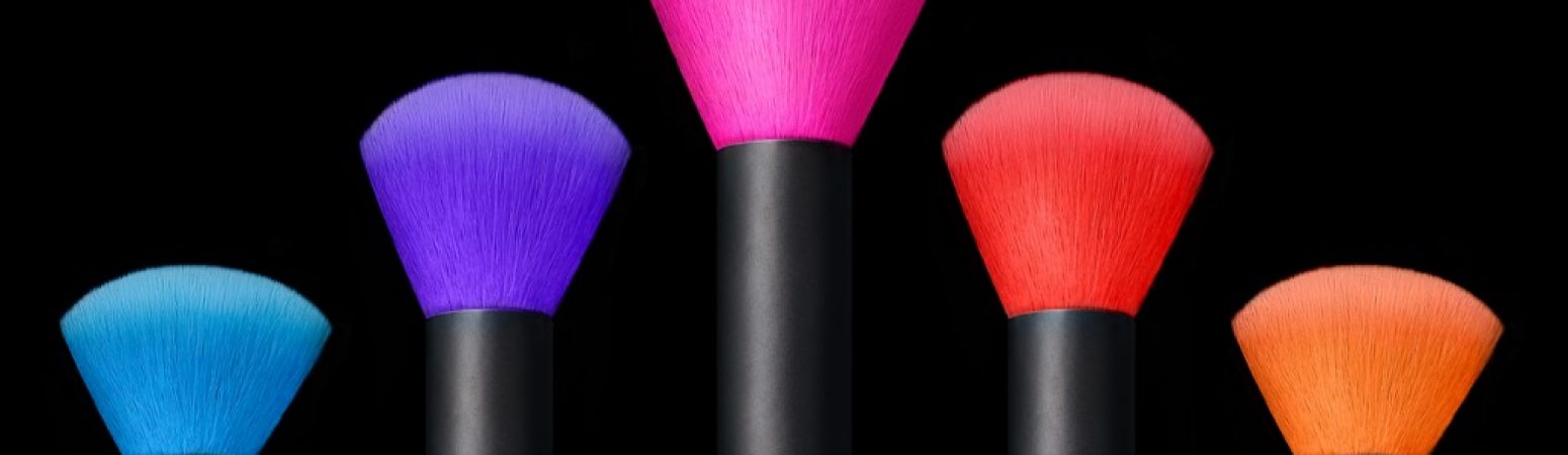 makeup-concept-colorful-make-up-brushes-over-black-background-picture-id525210096